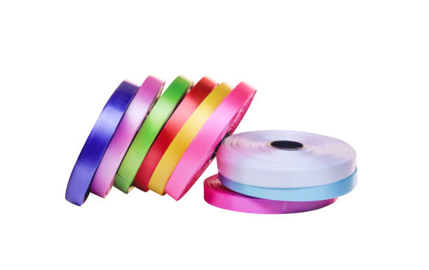 istock Multicolored ribbon roll  pile isolated on white background , clipping path 1351768204