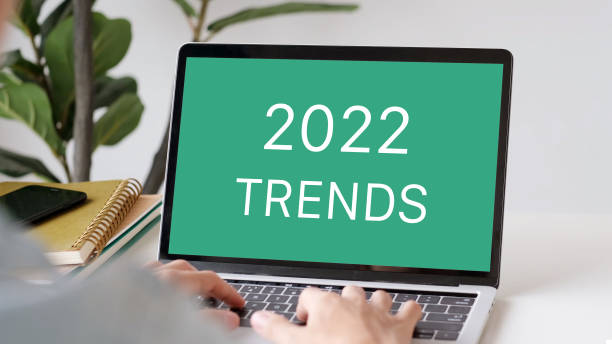 istock 2022 trends on laptop computer screen background, business plan and technology concept 1351772080