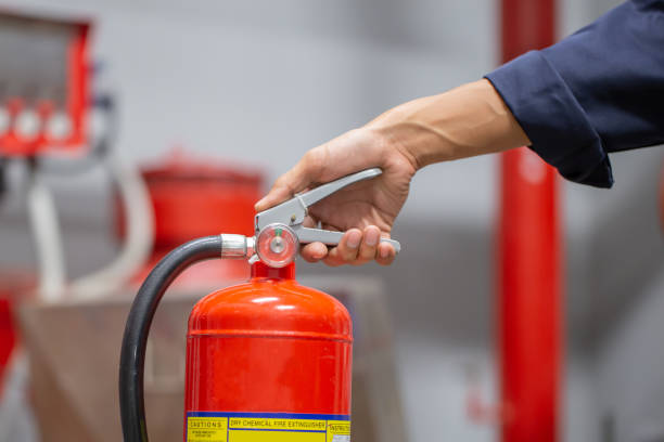 istock Engineer are checking and inspection a fire extinguishers tank in the fire control room for safety training and fire prevention. 1351772943