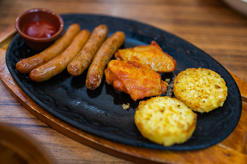 Sausage, Chicken Wings and Potato Cake