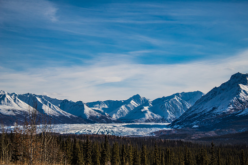 A roadside view of the Matanuska Glacier and snow capped mountains in Alaska