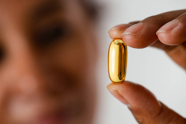istock Woman Showing Pill 1351785741