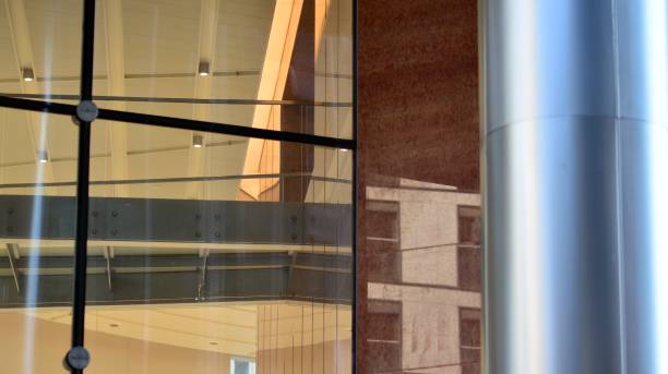 istock Modern office building with glass facade on a clear sky background. 1351786695