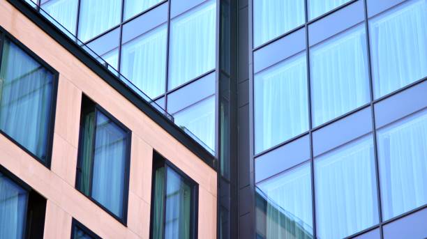 istock Modern office building with glass facade on a clear sky background. 1351786765