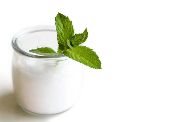 istock A glass jar with a moisturizer or balm. Top with a sprig of mint. Space for text. 1351792586