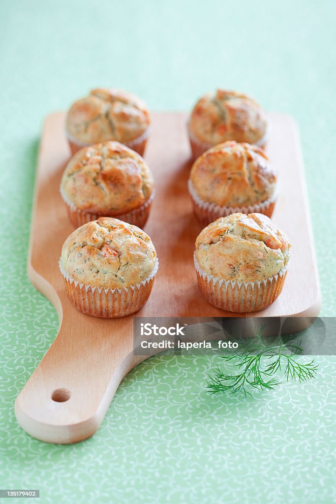 Savoury muffins Savoury muffins with salmon and dill on wooden board, selective focus Muffin Stock Photo