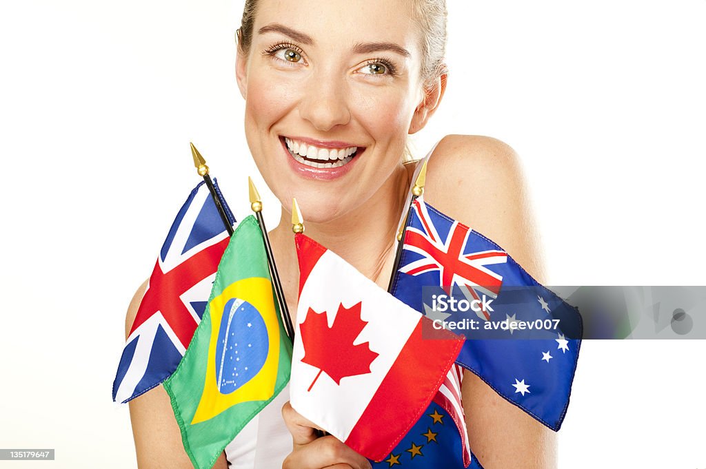smiling young woman with  flags Beautiful smiling young woman holden flags. Isolated on white.  Adobe RGB Flag Stock Photo