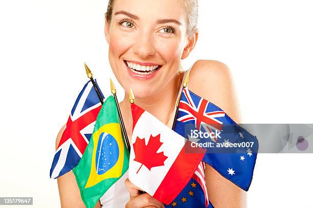 Smiling Young Woman With Flags Stock Photo - Download Image Now - Flag, Global Communications, Holding