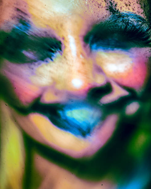 Color art face and body painting on woman for inspiration. Abstract portrait of the bright beautiful girl with colorful make-up and bodyart.