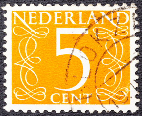 Stamp printed in the Netherlands shows the number 5, circa 1950