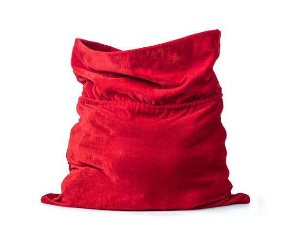 istock Santa Claus open red bag full, isolated on white background. File contains a path to isolation. 1351799261