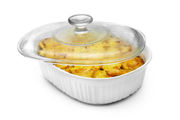 Baked potato in ceramic container with lid. Isolated on white.