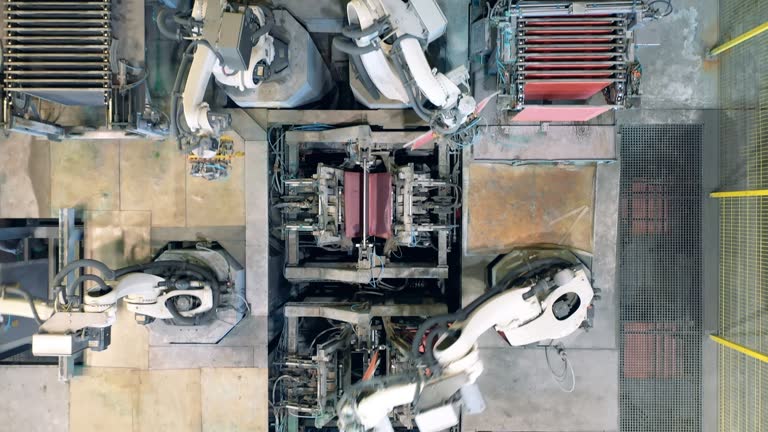 Robotic machines are bending and relocating copper plates