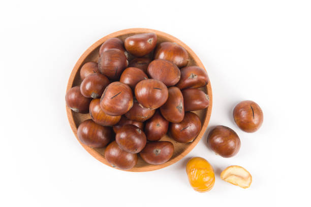 istock Close-up Chestnuts with peeled  isolated on white background. 1351801814