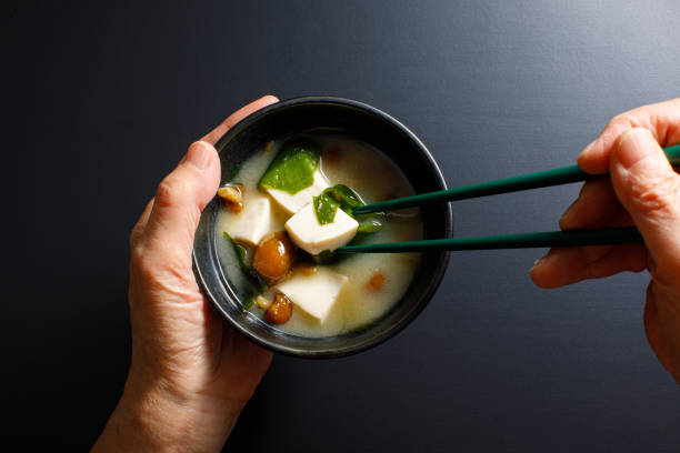 Japanese Homemade Miso Soup Vegan Recipe A vegan dish made by adding vegetables, tofu, or pumpkin to miso soup made from soybeans. MISO SOUP stock pictures, royalty-free photos & images