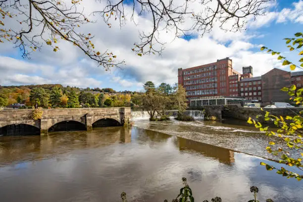 Strutt's North Mill on River Derwent at Belper in Derbyshire, England. This is a world heritage site built in 1804 after the original building (1786) was destroyed by fire in 1803. This cotton mill is one of the oldest surviving examples of its kind - an iron 'fire-proof' building.