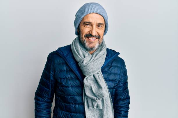 middle age hispanic man wearing winter style with a happy and cool smile on face. lucky person. - coat warm clothing one person joy imagens e fotografias de stock