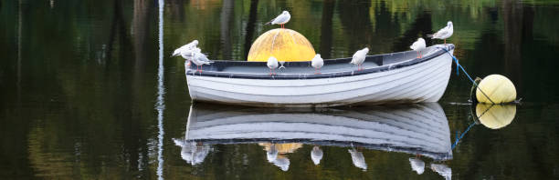 Blue boat in lake for tranquility calm peace and mindfulness UK