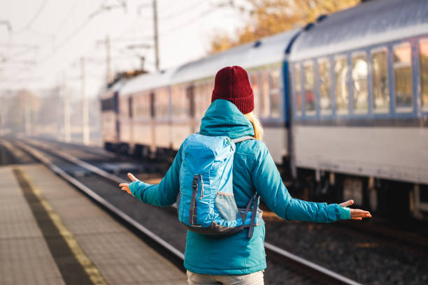 istock Confused tourist standing at wrong railway station platform 1351811834