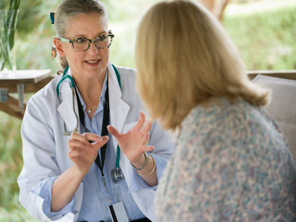 istock Doctor Assisting Patient in Homecare Environment 1351813145