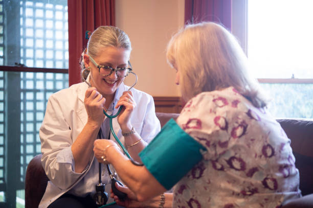 istock Doctor Assisting Patient in Homecare Environment 1351813196