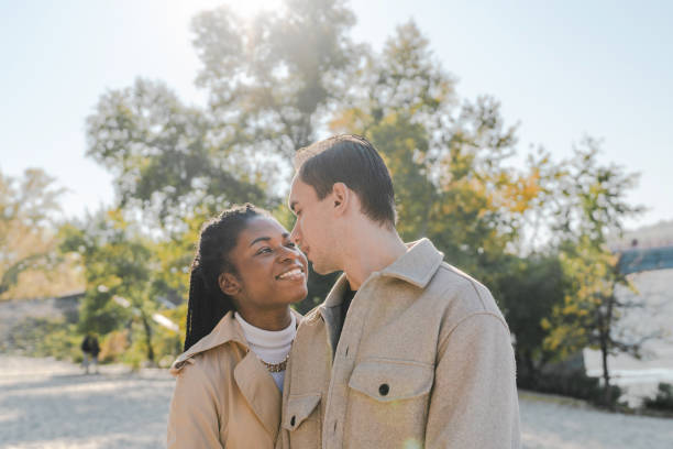 istock Couple resting on the beach in autumn 1351817473