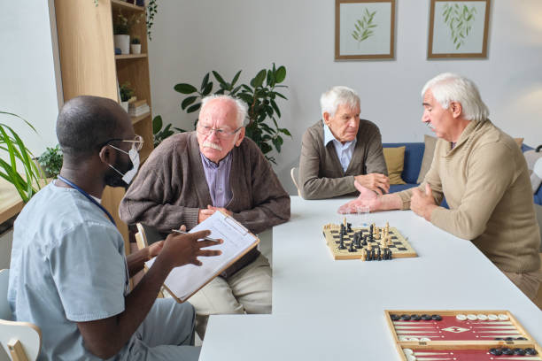 istock Doctor talking to senior people 1351817685