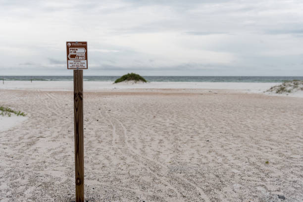 istock Pack it In, Pack It Out Sign in Pensacola beach, Florida. 1351819581