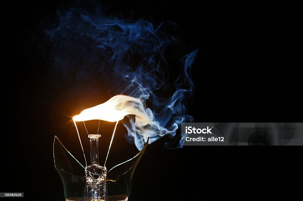 Broken lamp Last flame of broken lamp Light Bulb Stock Photo
