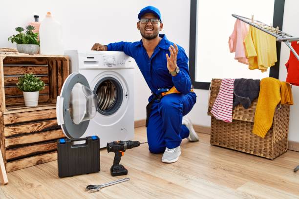 istock Young indian technician working on washing machine crazy and mad shouting and yelling with aggressive expression and arms raised. frustration concept. 1351827170