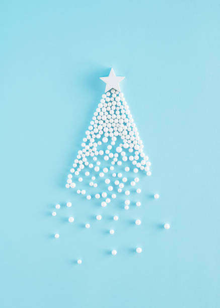 Creative Christmas tree arrangement made of white pearls and wooden star on a blue backgorund. Minimal 
New Year concept. Creative Christmas tree arrangement made of white pearls and wooden star on a blue backgorund. Minimal 
New Year concept. christmas star shape christmas lights blue stock pictures, royalty-free photos & images