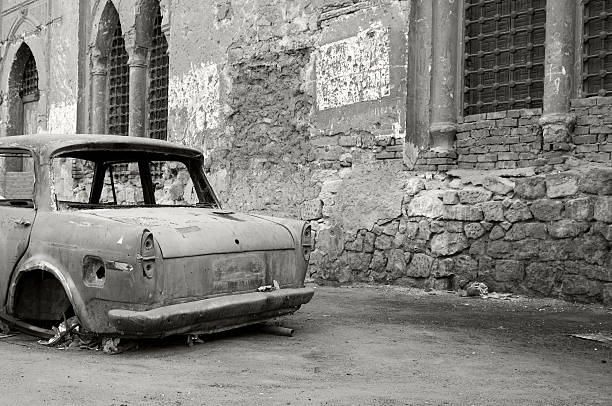 istock junked car and old walls in Cairo, Egypt 135183312