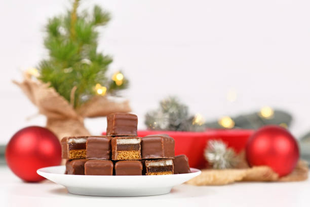 Christmas sweets called 'Dominosteine'. German candy consisting of gingerbread, jelly and marzipan layers covered with chocolate icing