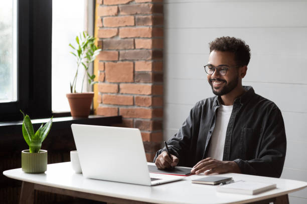 istock Young man working from home. Creative professional have meeting online 1351833896