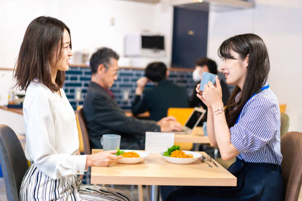 istock Employees eating lunch in the office cafeteria 1351834069