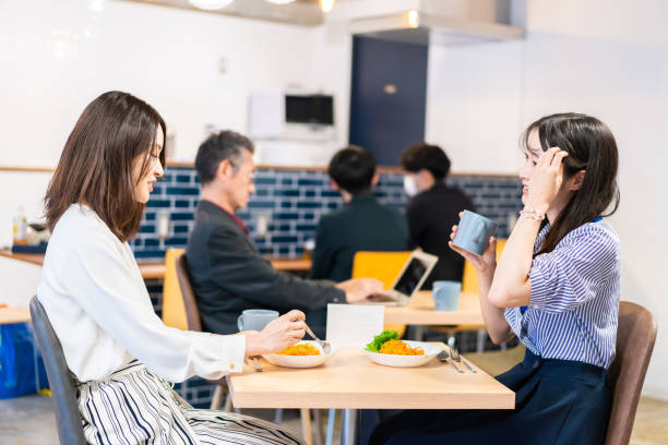 istock Employees eating lunch in the office cafeteria 1351834078