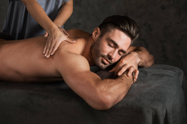 Man getting a back massage stock photo