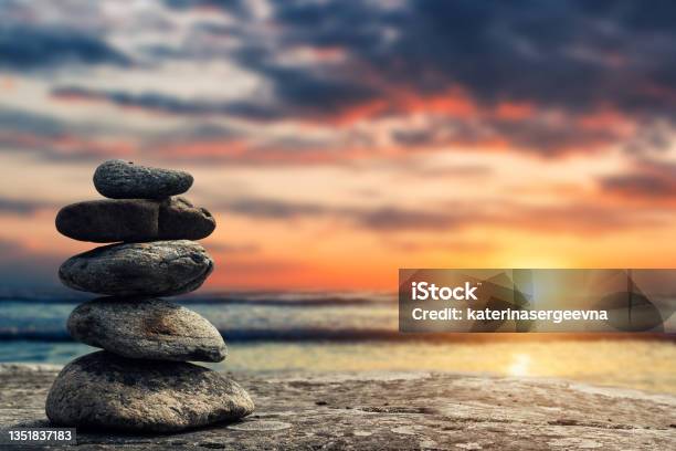 Zen Pyramid Of Stones On The Background Of Sunset And Sea Stock Photo - Download Image Now