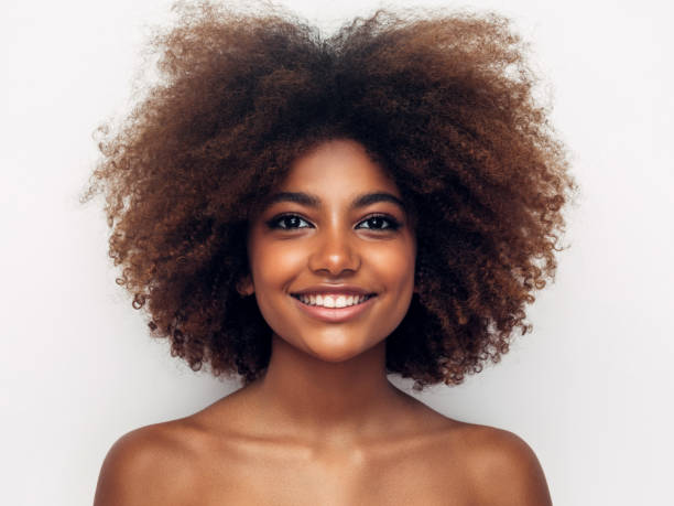 istock Beautiful smiling girl with curly hairstyle 1351837680