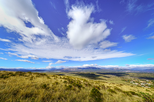 Beautiful clouds above the mountains in a landscape of the Sierra Guadarrama in Madrid.