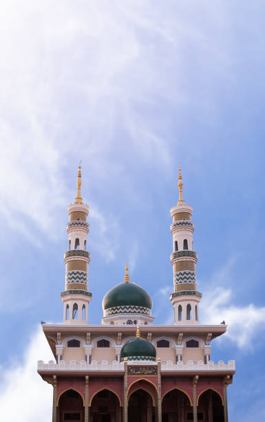 istock Mosques Dome on blur blue sky on day time background 1351841943