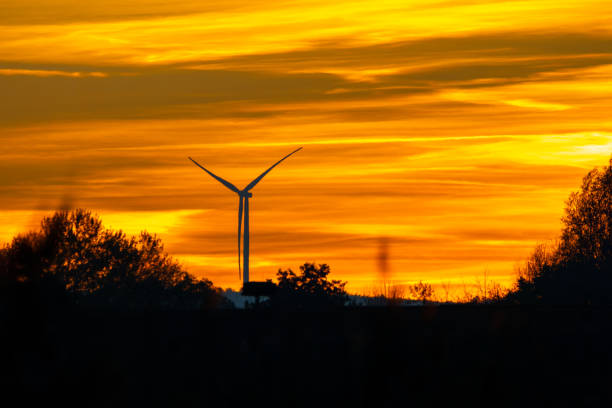 istock A windmill on a little hill in Hesse, Germany at sunset. 1351842489