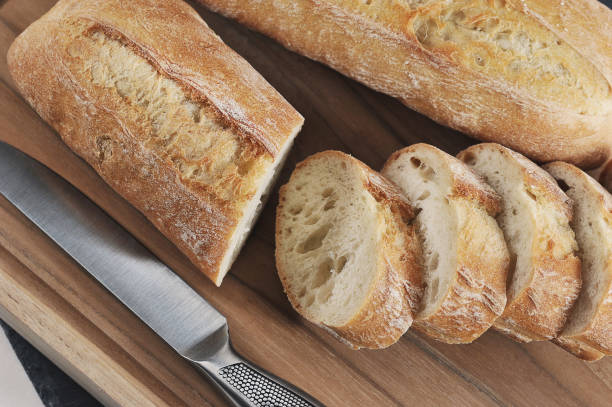 istock small French baguette on a wooden board 1351845406