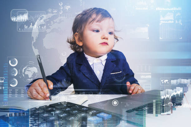 istock Child is holding a pen and looking at laptop 1351846478