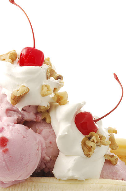 istock Banana split with whipped cream, nuts, and cherries.  135184660