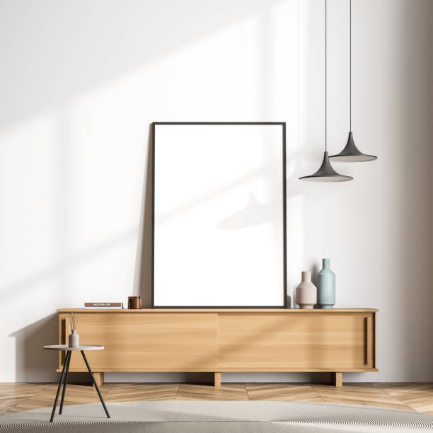 istock Modern living room sideboard with standing canvas next to white wall 1351846768