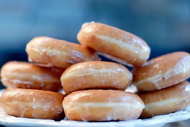 stack of glazed doughnuts. shallow depth of field.