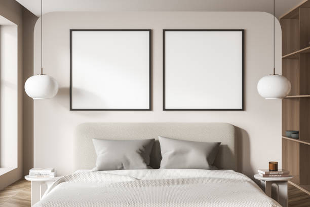 istock Beige bedroom interior with bed and linens, mockup posters 1351849106