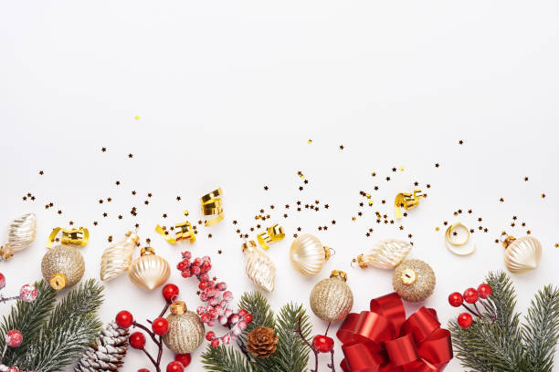 istock Christmas composition. Christmas pink gift or present box, gold baubles and confetti on white background. Flat lay, top view. Magic Christmas greeting card. Border design. Mock up. 1351849896