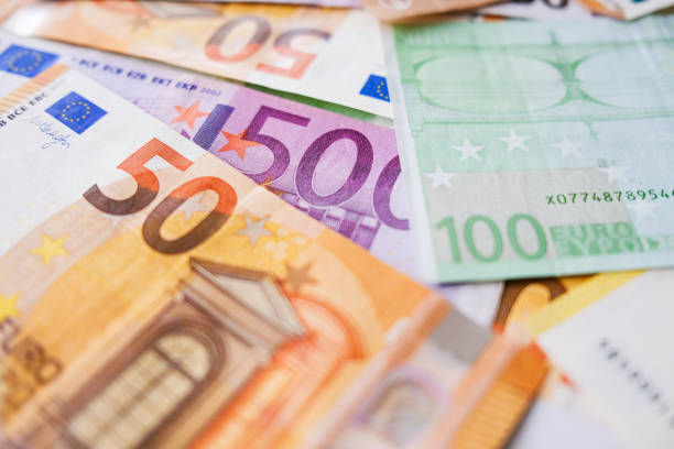 istock Various Euro banknotes as background image for financial topics. 1351850890